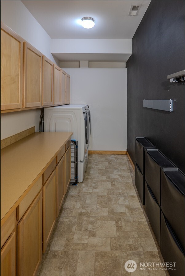 9723 Phillips Road Southeast Port Orchard, WA 98367 - Photo 31 of 37 a room with storage and utility