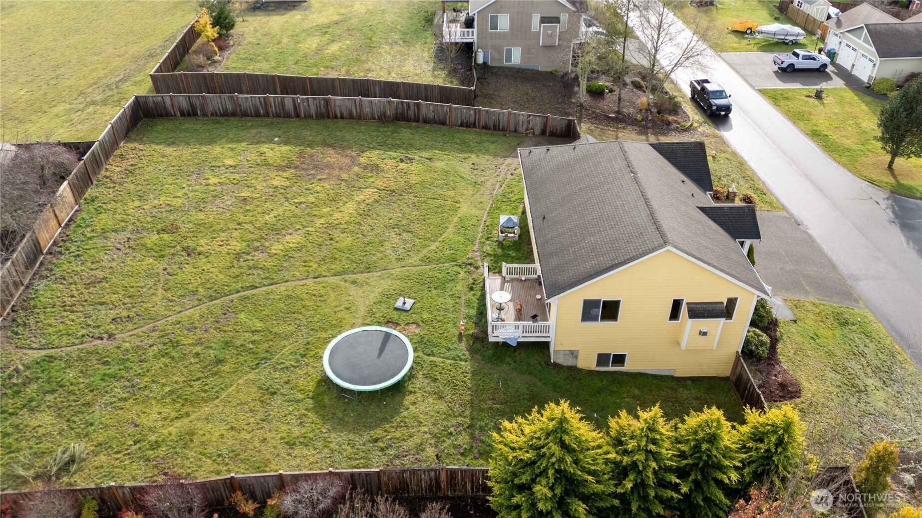 9723 Phillips Road Southeast Port Orchard, WA 98367 - Photo 32 of 37 a view of a swimming pool with a yard