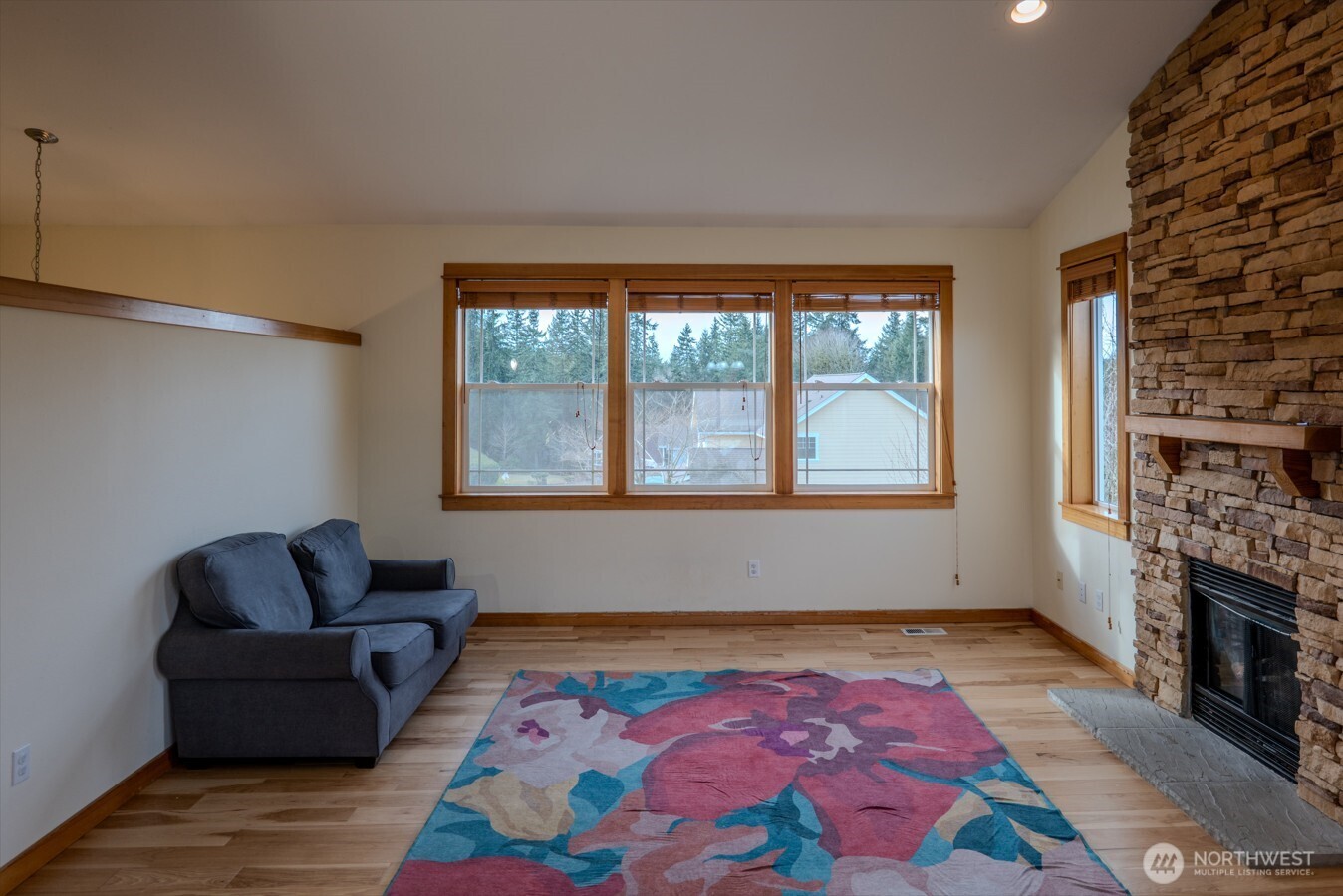 9723 Phillips Road Southeast Port Orchard, WA 98367 - Photo 5 of 37 a living room with furniture and a fireplace