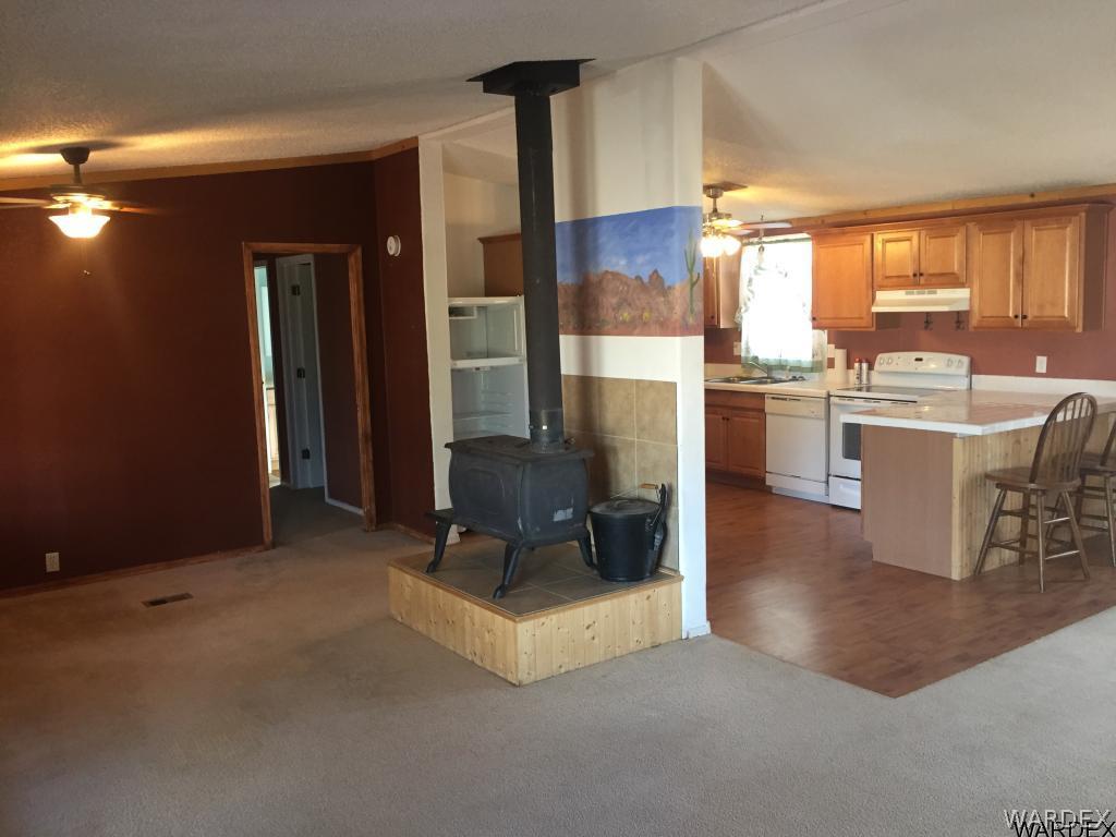 3589 Mobile Road Golden Valley, AZ 86413 - Photo 3 of 11 a kitchen with counter top space and appliances