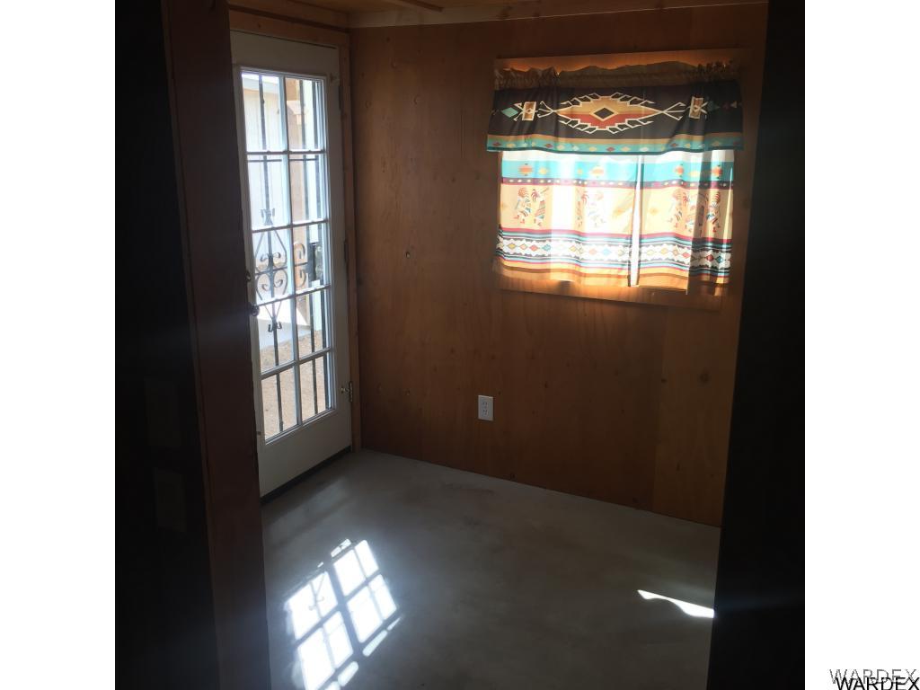 3589 Mobile Road Golden Valley, AZ 86413 - Photo 9 of 11 a view of an empty room with a window