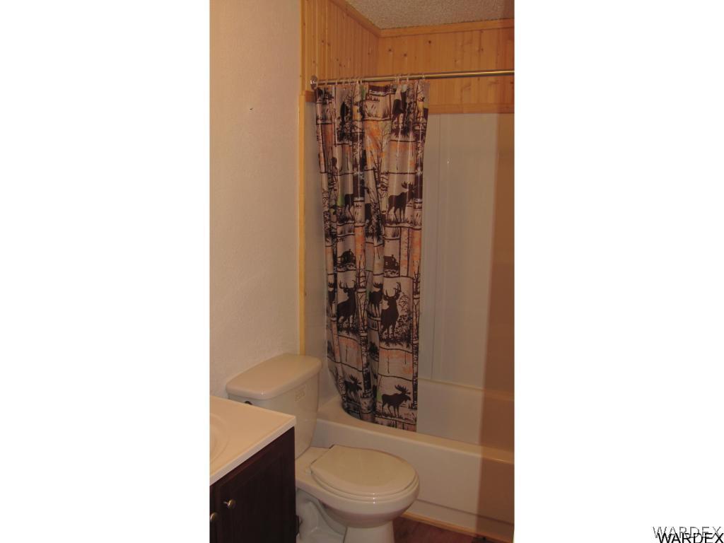 3589 Mobile Road Golden Valley, AZ 86413 - Photo 10 of 11 a bathroom with a toilet and a shower