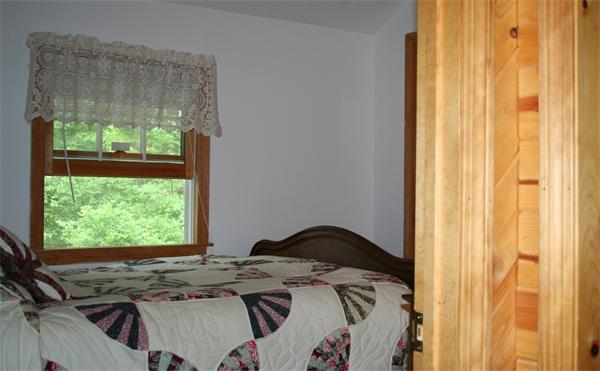 35 Fountain Road Wales, MA 01081 - Photo 13 of 26 a bed sitting in a bedroom next to a window