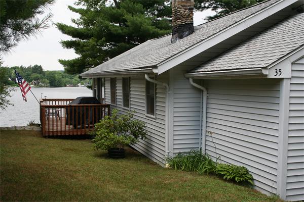 35 Fountain Road Wales, MA 01081 - Photo 5 of 26 a view of a small house with a yard and furniture