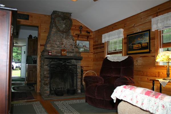 35 Fountain Road Wales, MA 01081 - Photo 10 of 26 a living room with furniture and a fireplace
