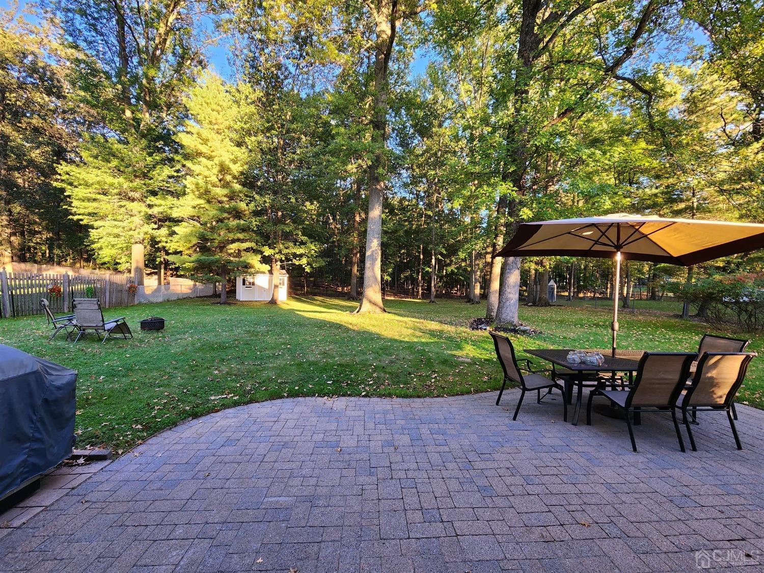 12 Warwick Road Edison, NJ 08820 - Photo 39 of 40 a view of backyard with seating and green space