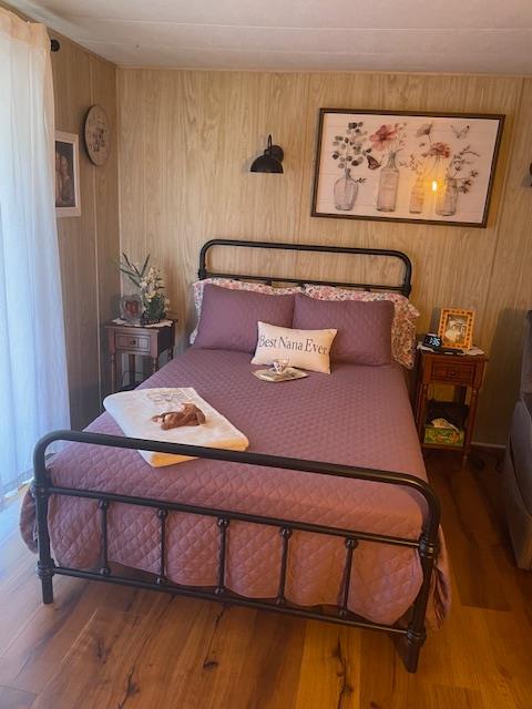 4125 Mchenry Avenue, Unit 35 Modesto, CA 95356 - Photo 12 of 20 a bedroom with a bed and wooden floor