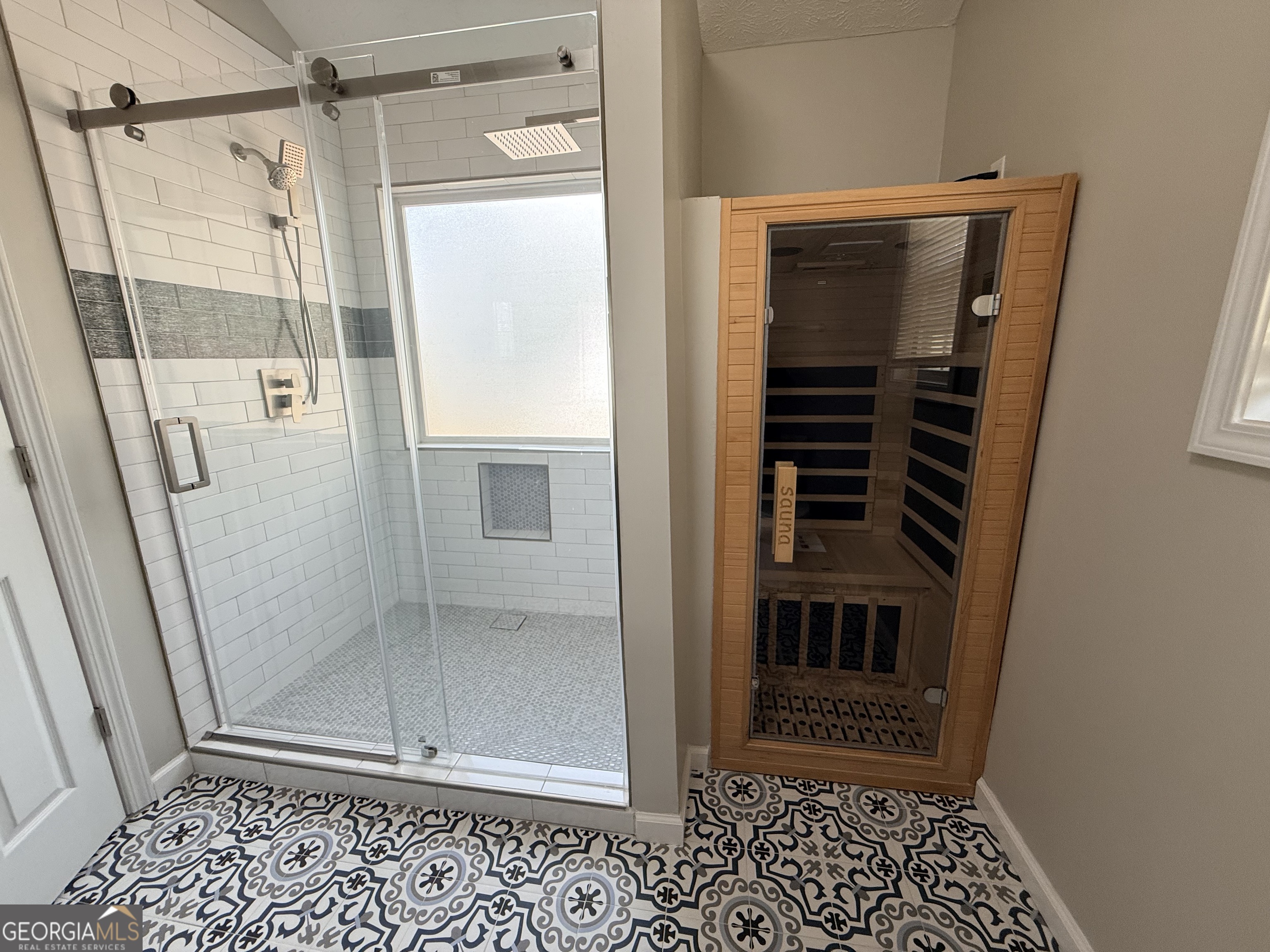 577 Pendergrass Road Winder, GA 30680 - Photo 16 of 25 a bathroom with a glass door shower