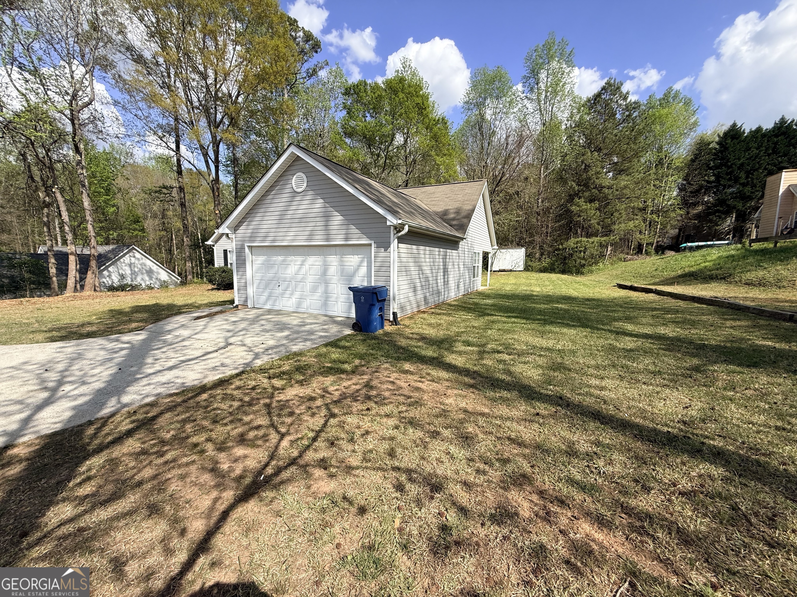 577 Pendergrass Road Winder, GA 30680 - Photo 22 of 25 a view of a house with a yard and large trees