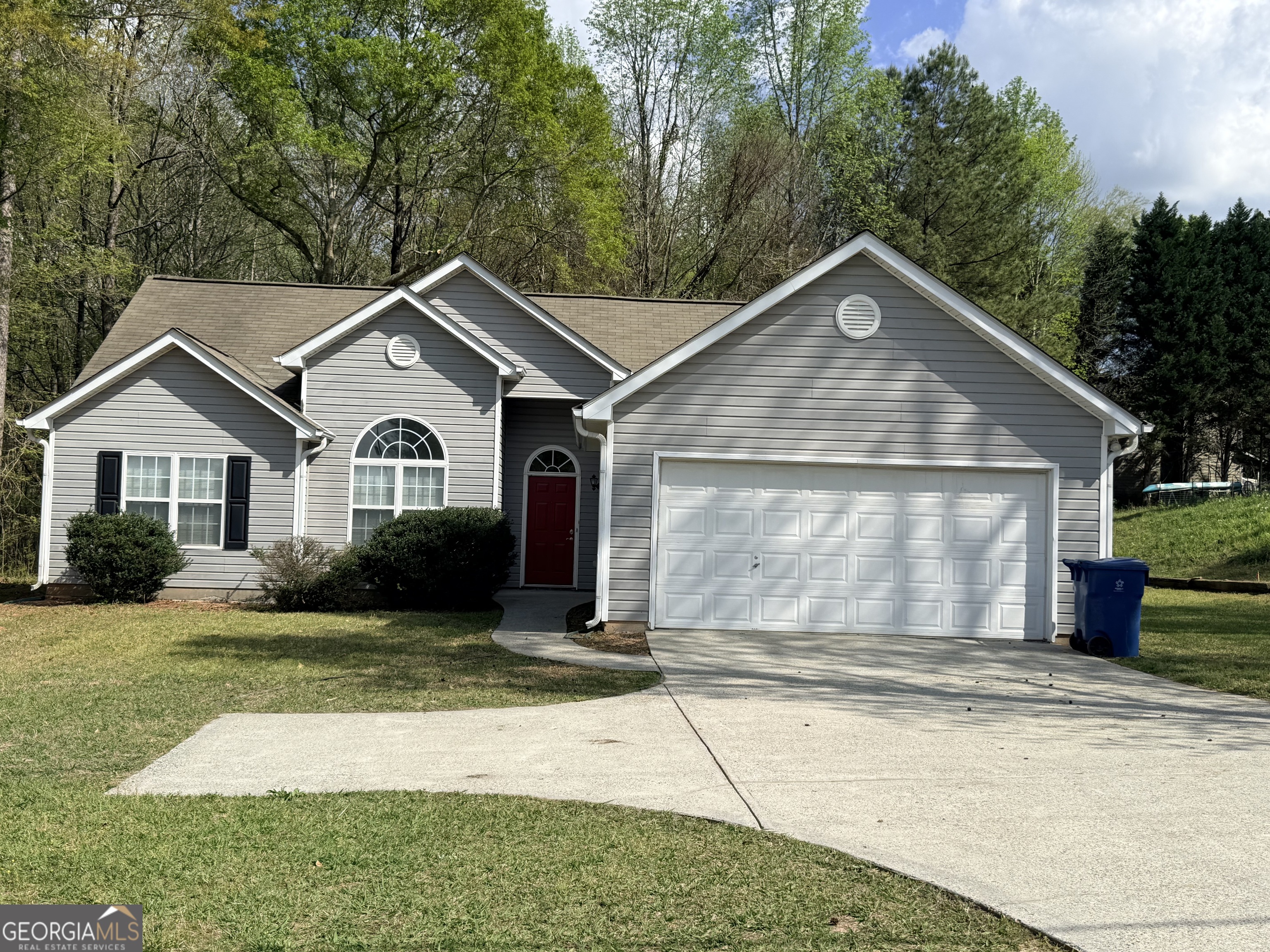 577 Pendergrass Road Winder, GA 30680 - Photo 23 of 25 a front view of a house with a yard and garage