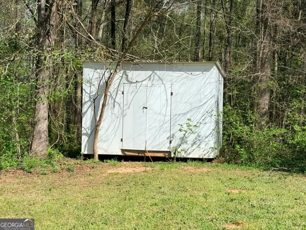 a front view of a house with yard