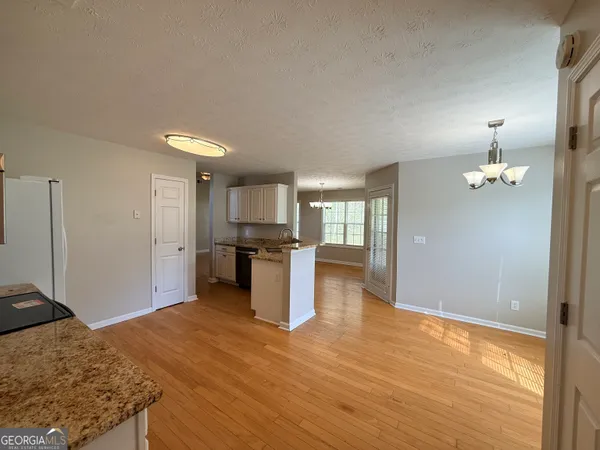 a kitchen with kitchen island sink refrigerator and stove