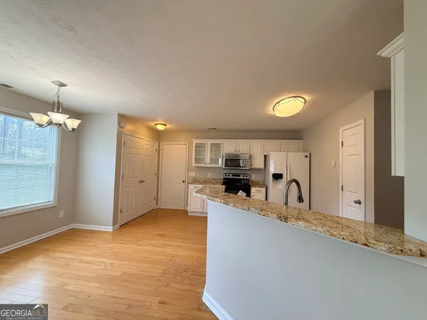 a view of a livingroom with wooden floor