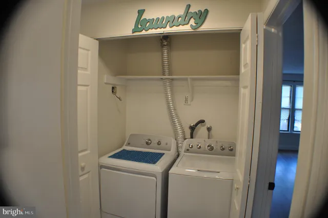 a room with a dryer and washer