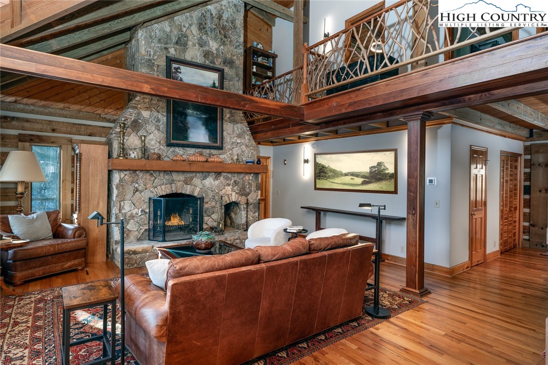 2560 Watauga River Road Sugar Grove, NC 28679 - Photo 11 of 50 a outdoor living space with furniture and a fireplace