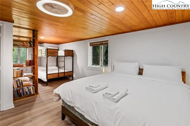 a bed room with bed and window