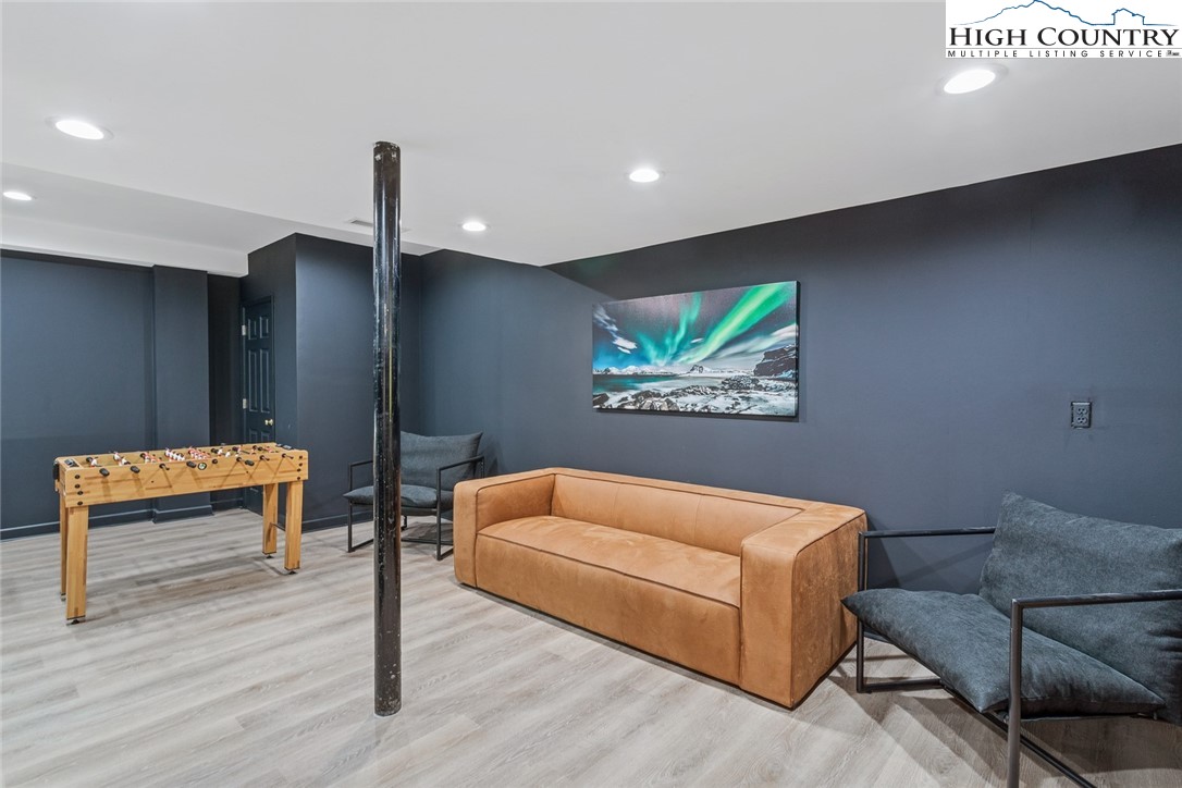 2560 Watauga River Road Sugar Grove, NC 28679 - Photo 33 of 50 a living room with furniture and a wooden floor
