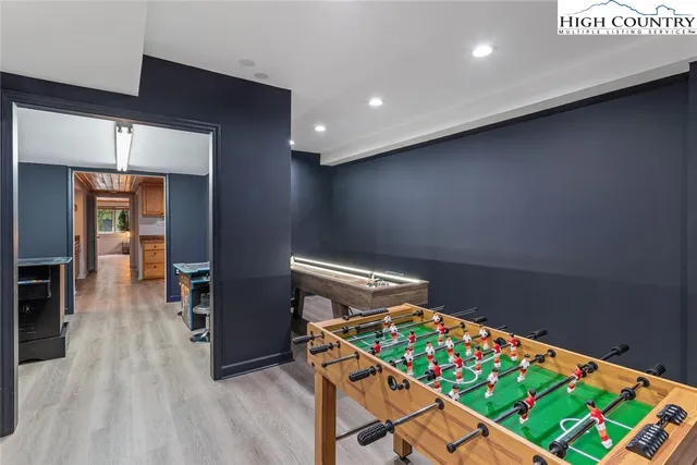 a view of balcony with wooden floor and outdoor seating