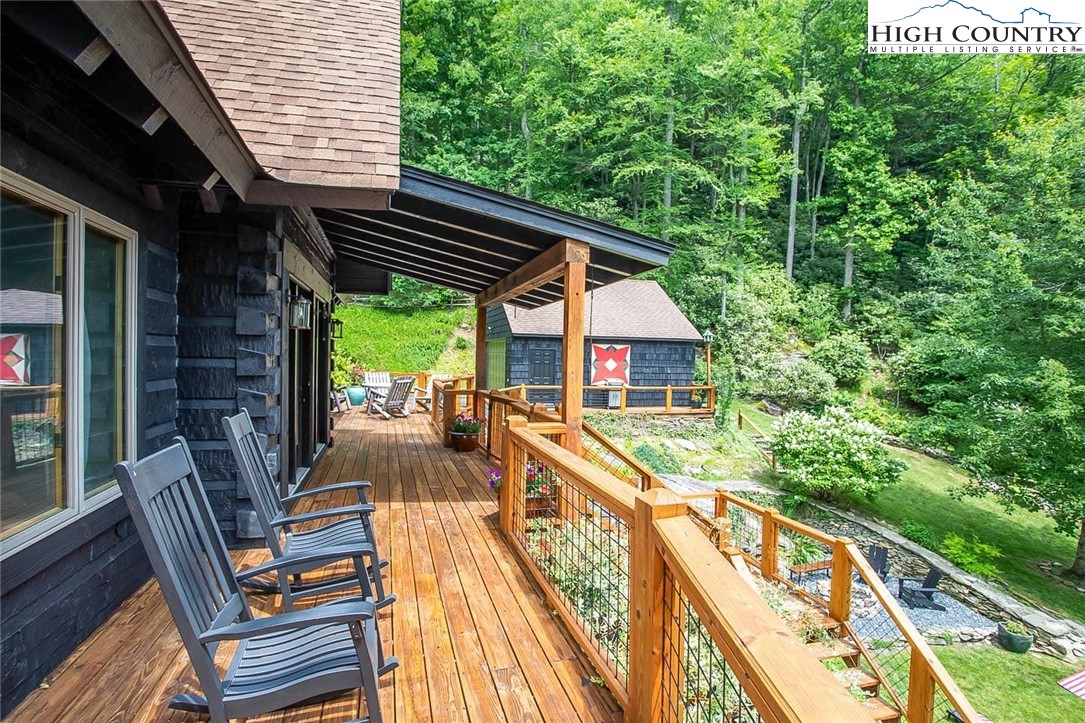 2560 Watauga River Road Sugar Grove, NC 28679 - Photo 36 of 50 a view of balcony with wooden floor and outdoor seating