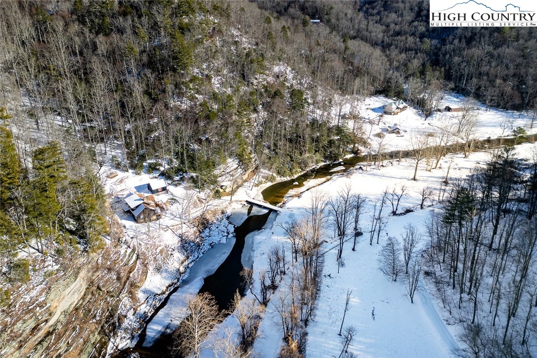 2560 Watauga River Road Sugar Grove, NC 28679 - Photo 43 of 50 a view of a yard covered with snow