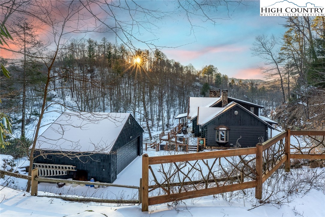 2560 Watauga River Road Sugar Grove, NC 28679 - Photo 48 of 50 a view of a house with large trees and sitting area