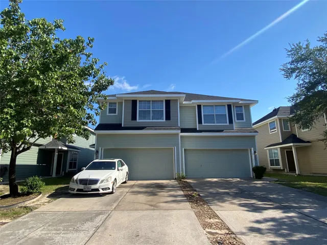 a car parked in front of a house
