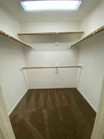a spacious bathroom with a sink a mirror and vanity