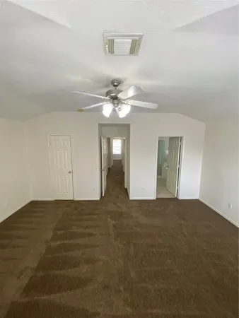 a view of a livingroom with a chandelier fan