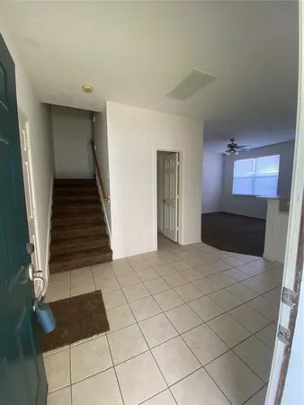 a view of a hallway view with staircase