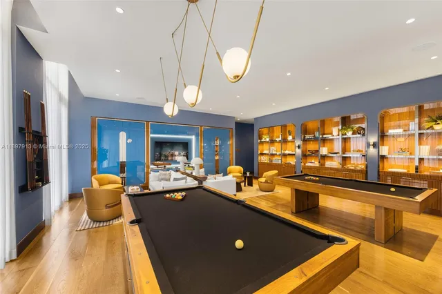 a dining room with furniture water view and a large window