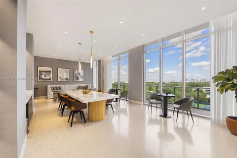 a large kitchen with stainless steel appliances lots of counter space and a sink