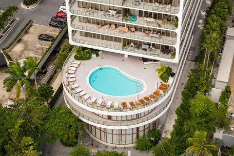 a living room with a large window and a table