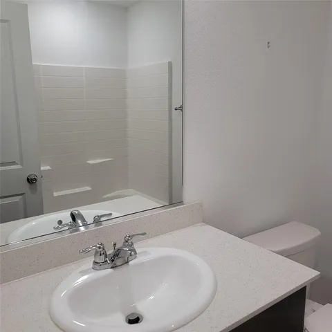 a bathroom with a sink and a vanity