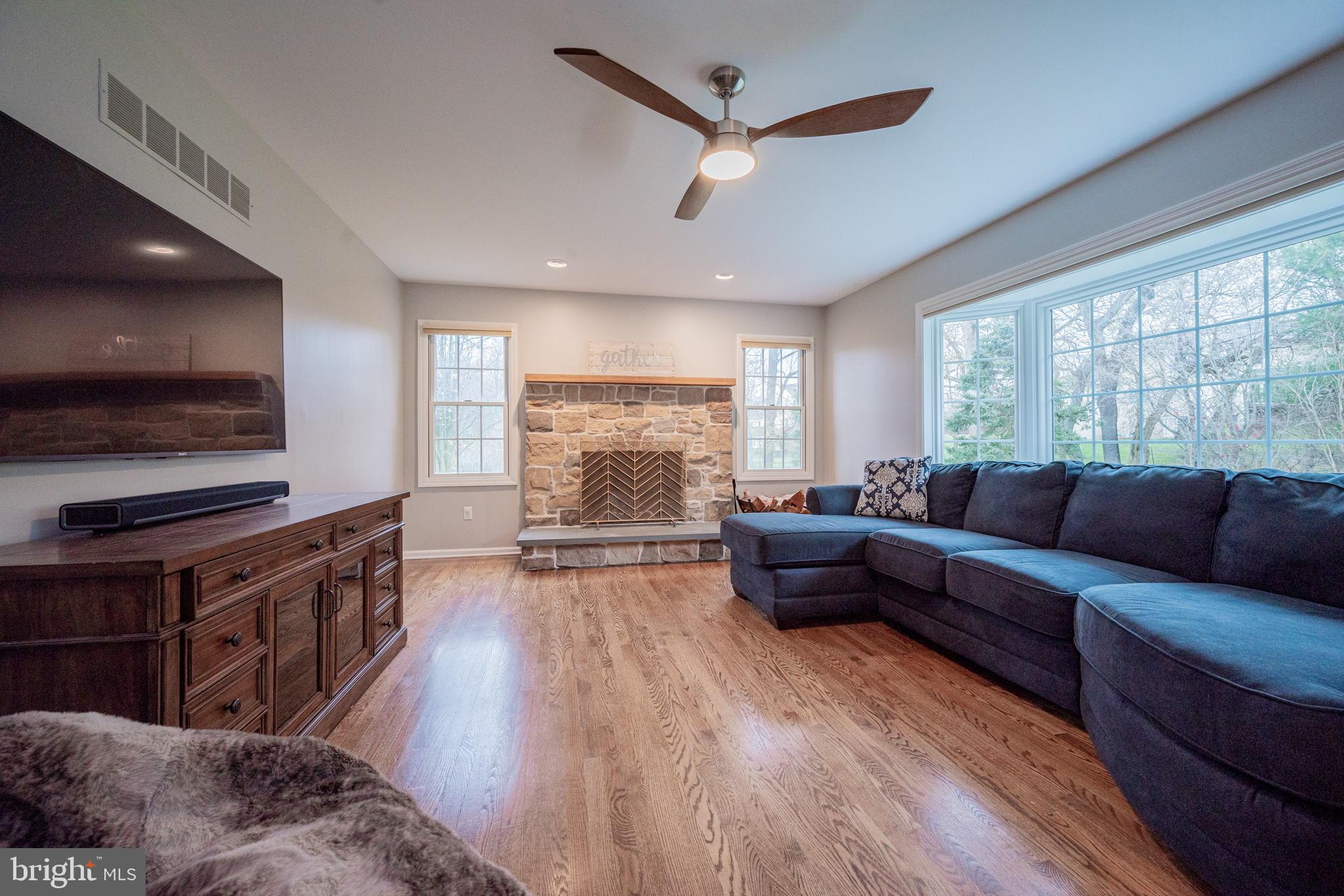 34 Raphael Road Hockessin, DE 19707 - Photo 23 of 60 a living room with furniture and a flat screen tv