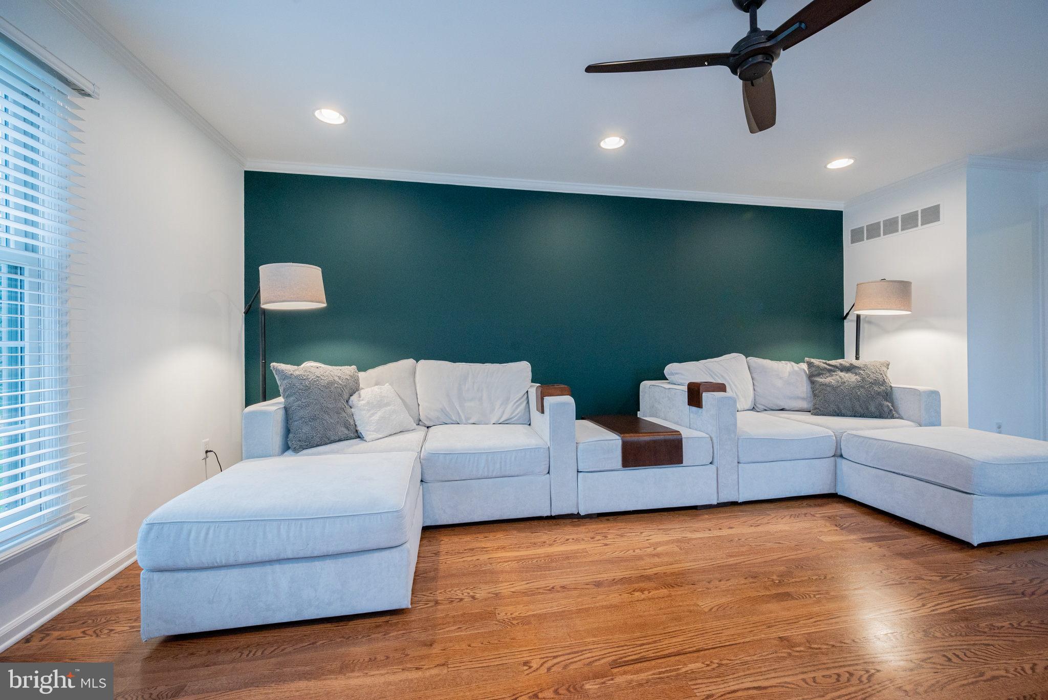34 Raphael Road Hockessin, DE 19707 - Photo 8 of 60 a living room with furniture and a flat screen tv