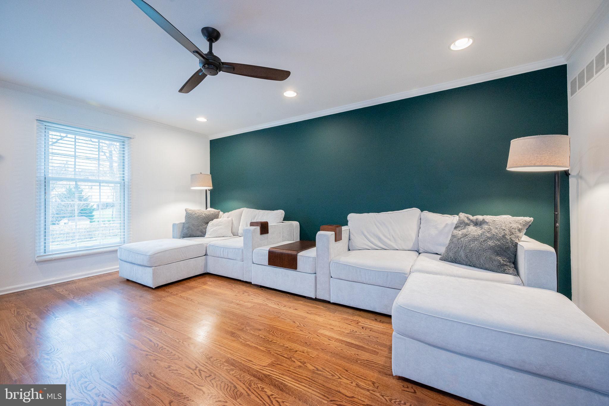 34 Raphael Road Hockessin, DE 19707 - Photo 10 of 60 a living room with furniture and a wooden floor