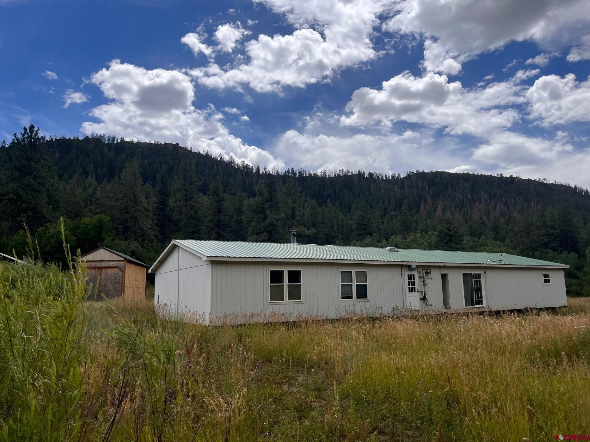 3230 Bear Creek Road Bayfield, CO 81122 - Photo 6 of 17 a view of a couches in front of the house