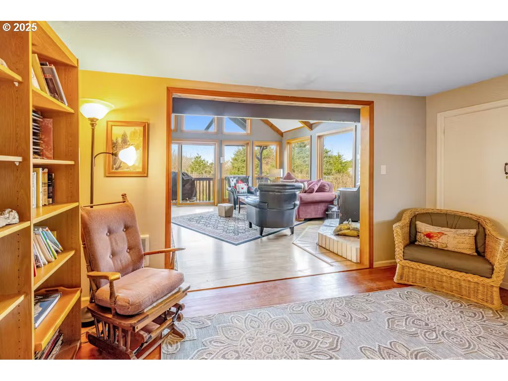 25990 Sandlake Road Cloverdale, OR 97112 - Photo 13 of 40 a living room with furniture and a large window