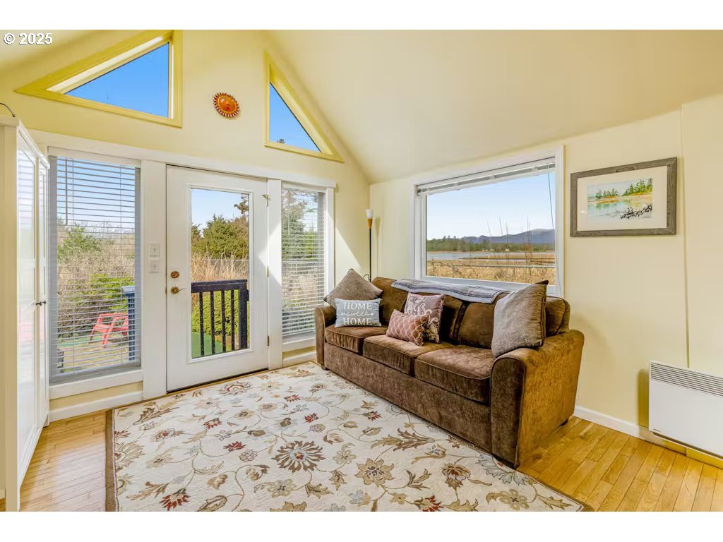 25990 Sandlake Road Cloverdale, OR 97112 - Photo 16 of 40 a living room with furniture and large window