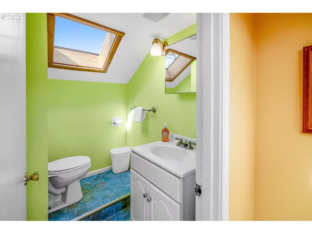 25990 Sandlake Road Cloverdale, OR 97112 - Photo 24 of 40 a bathroom with a sink and a mirror