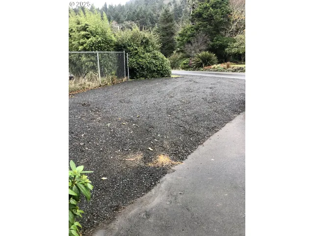a view of a backyard of the house