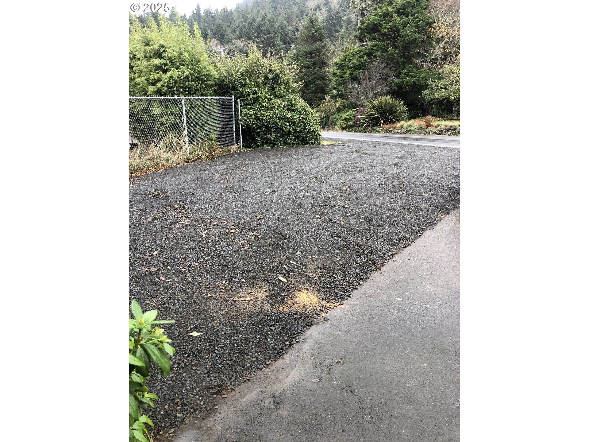 25990 Sandlake Road Cloverdale, OR 97112 - Photo 37 of 40 a view of a yard with plants and wooden fence