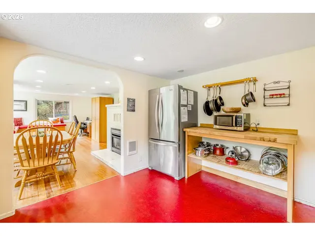 a view of kitchen with furniture and wooden floor