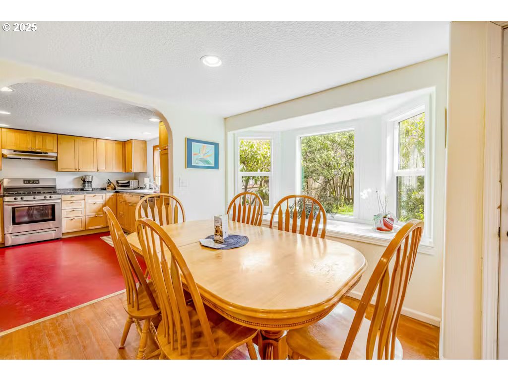 25990 Sandlake Road Cloverdale, OR 97112 - Photo 5 of 40 a dining room with furniture a window and open kitchen view