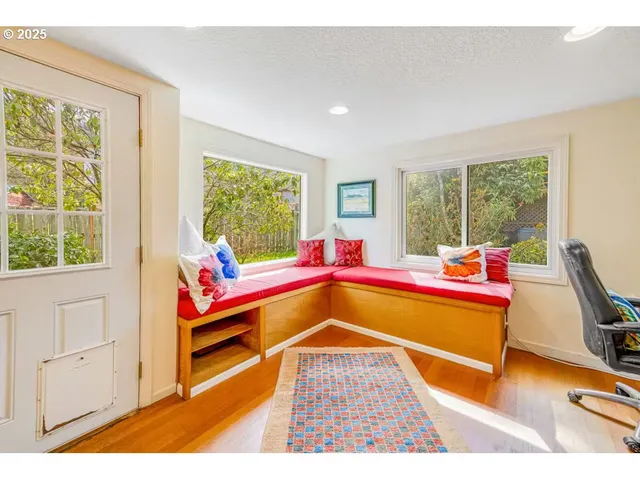 a living room with a rug floor and a table