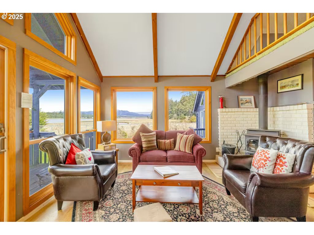 25990 Sandlake Road Cloverdale, OR 97112 - Photo 8 of 40 a living room with furniture and a large window