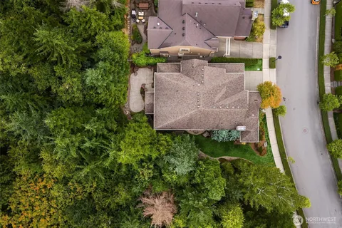 an aerial view of a house with a yard