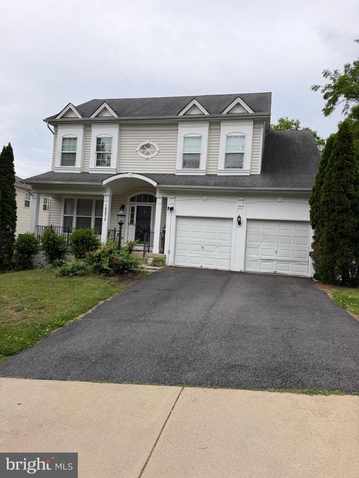 18970 Rosings Way Triangle, VA 22172 - Photo 1 of 16 a front view of a house with a yard and garage