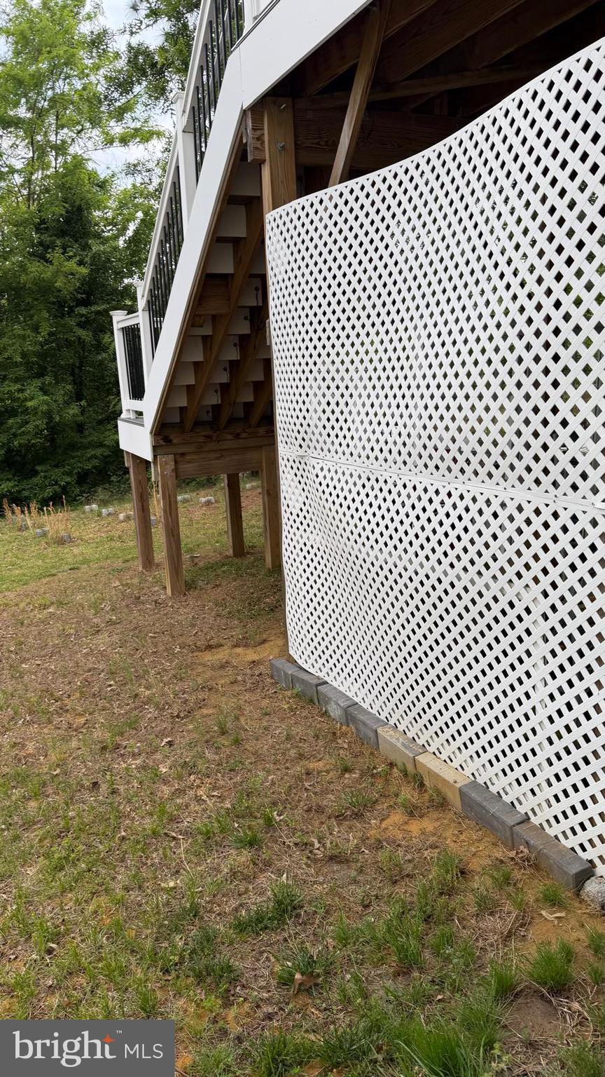 18970 Rosings Way Triangle, VA 22172 - Photo 14 of 16 a view of outdoor space with wooden deck