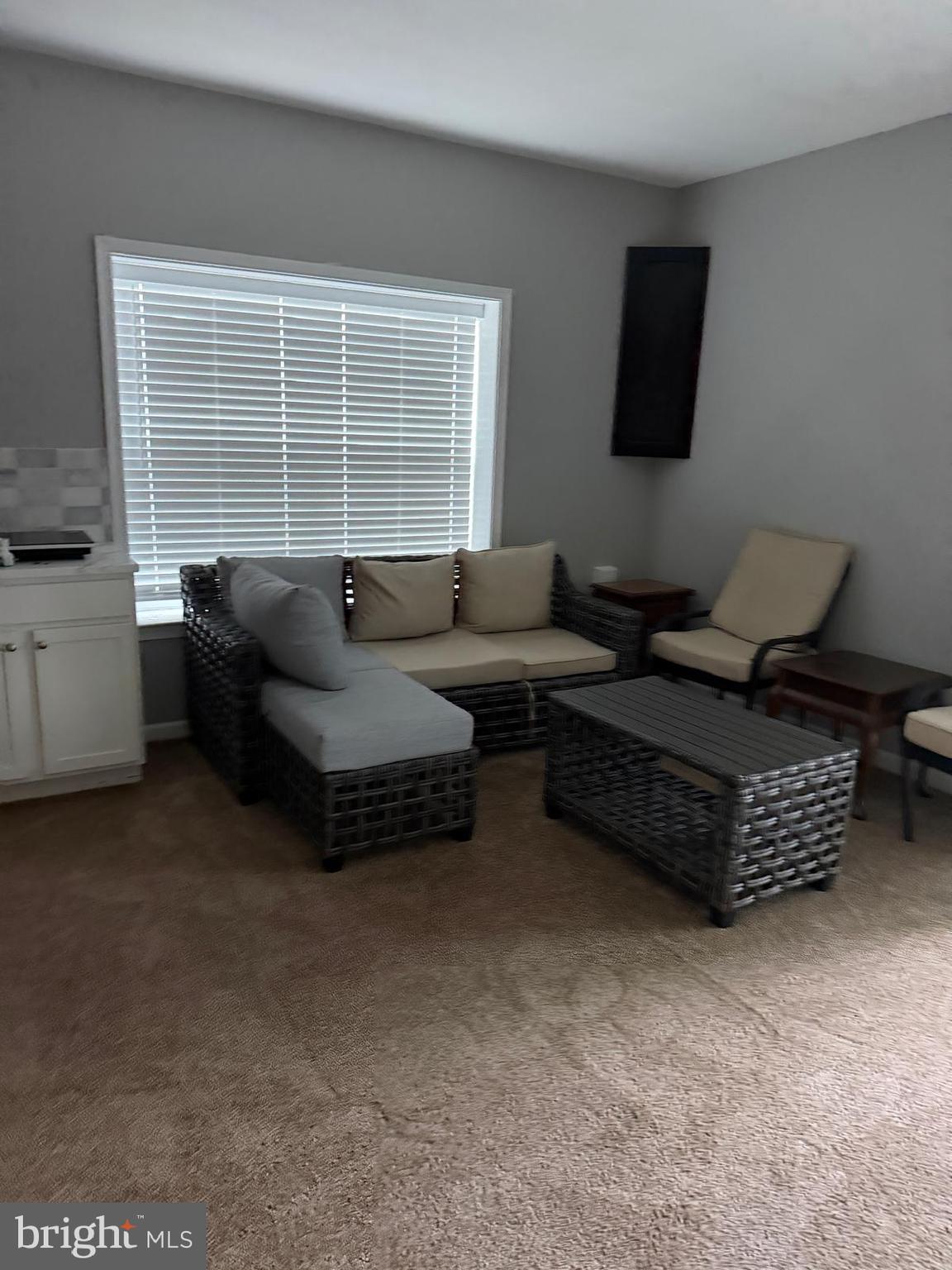 18970 Rosings Way Triangle, VA 22172 - Photo 3 of 16 a living room with furniture and a flat screen tv